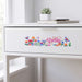 Prism Print - 250 x 50mm Sticker - A drawer with a white finish featuring a colourful floral sticker with butterflies and the name "Abelia".