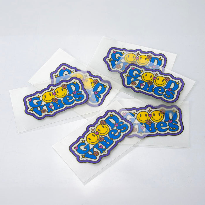 Prism Print - 60 x 40mm Sticker - A collection of colourful stickers featuring playful designs and a logo on a white background.