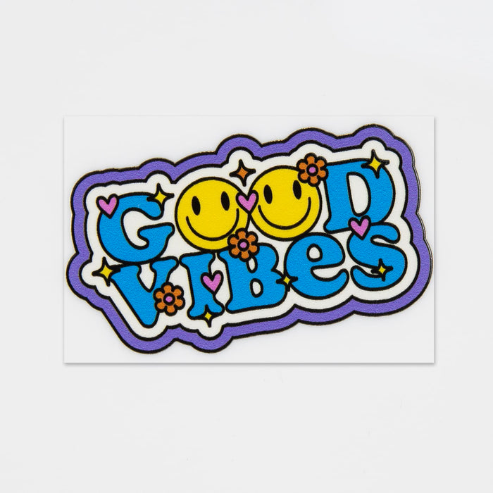 Prism Print - 60 x 40mm Sticker - A colourful sticker featuring the phrase "Good Vibes" with smiling faces and floral designs in bright hues.