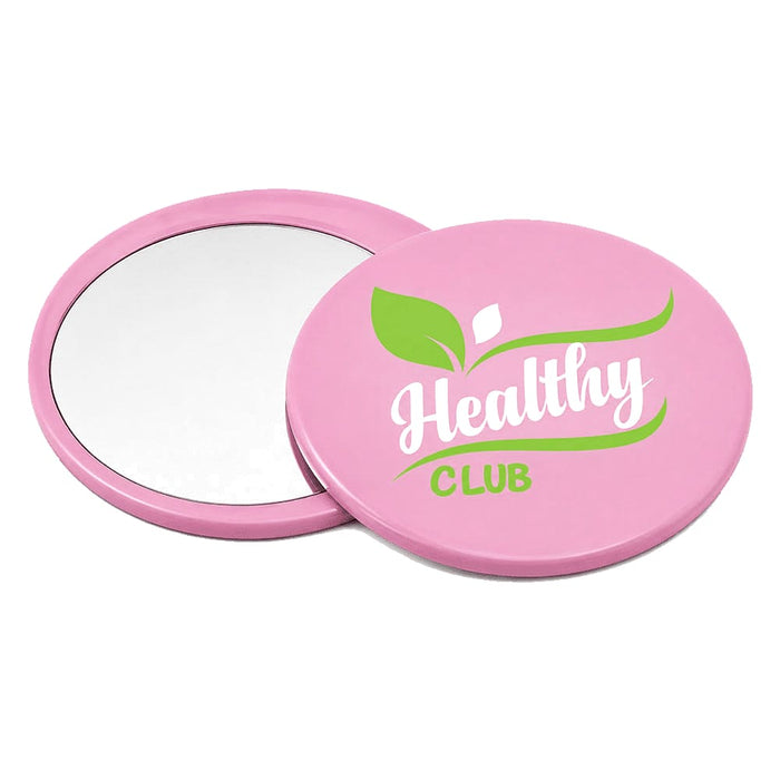 Glider slider makeup mirror - A pink circular makeup mirror with a reflective surface and a logo featuring green design elements.