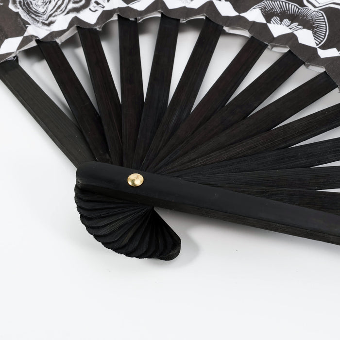8inch Bamboo Fabric Hand Fan - An 8-inch bamboo fabric hand fan with a black wooden frame and decorative fabric design featuring shades of white and black.