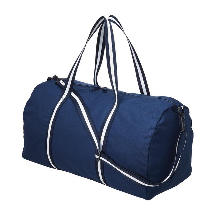 Canvas Duffle - A navy canvas duffle bag with contrasting white handles and stripes, featuring a zip closure and a shoulder strap.
