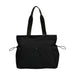 Lightweight Tote Bag With Yoga Mat Straps - A lightweight black tote bag with yoga mat straps and two front pockets. It has long handles for easy carrying.