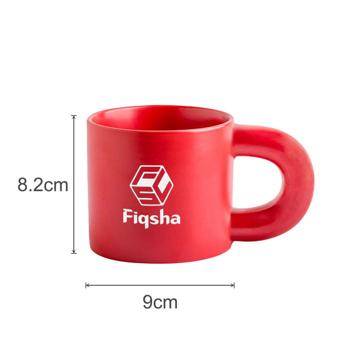 Laser Engraving Ceramic Coffee Mug - A red ceramic coffee mug with a unique handle design and a logo printed on the side. Dimensions are 8.2 cm high and 9 cm wide.
