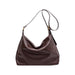 Dumpling Polyurethane Tote Bag - A brown polyurethane tote bag with a slouchy design and a single shoulder strap. It features a logo.