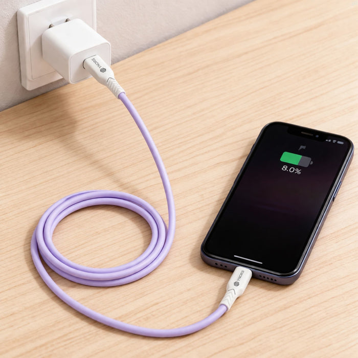 100W Fast Charging Cable - A purple 100W fast charging cable connected to a wall charger and an iPhone on a wooden surface.