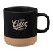 Santos 350ml Artisanal Ceramic Coffee Mug - A 350ml artisanal ceramic coffee mug in black with a tan base, featuring a logo on the side.