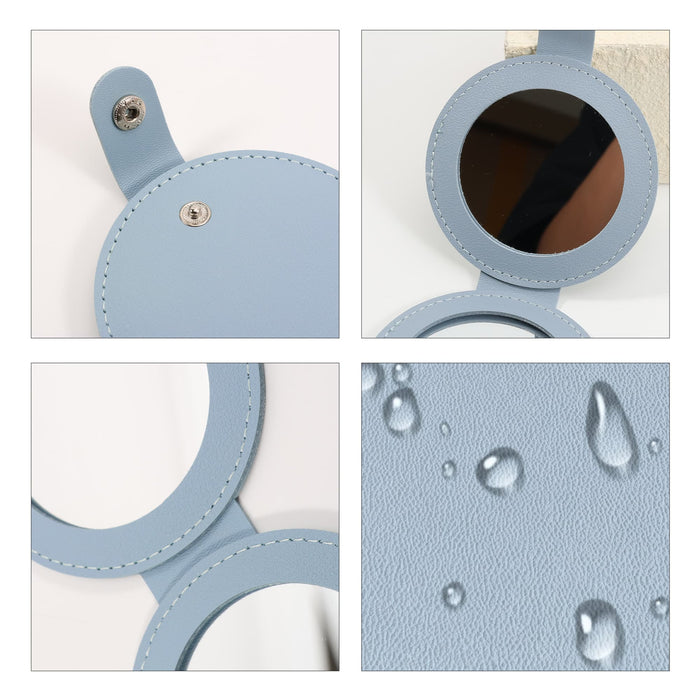 Round Folding Pocket Mirror - A round folding pocket mirror in light blue, featuring a smooth finish and water droplets on its surface.