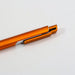 NFC Touchscreen Ballpoint Pen - An orange ballpoint pen with a sleek design and a clip. It has a metallic finish and a logo on its body.