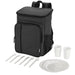 Tundra GRS RPET Picnic Cooler Backpack w/ Cutlery Set 20L - A black picnic cooler backpack with cutlery set, including plates, cups, forks, and spoons. It has a logo.