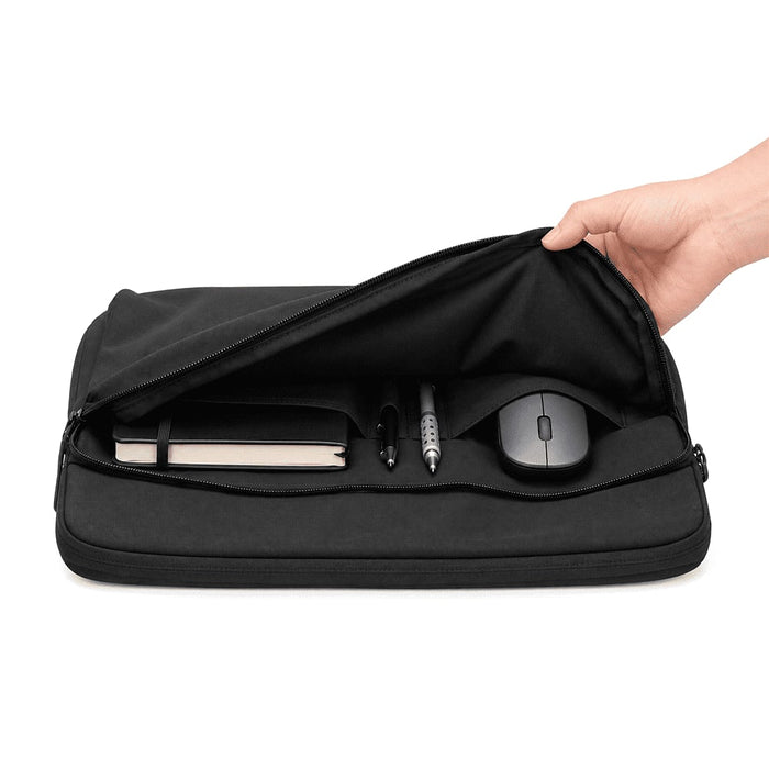 Rime Laptop Sleeve - A black laptop sleeve with a zip opening, containing a notebook, pens, and a mouse inside.