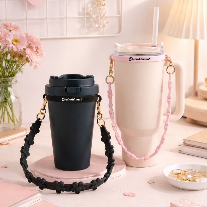 Silicone Flower Tumbler Strap - A drink bottle set featuring a black tumbler and a pink flower strap with a cream tumbler, both with logos.