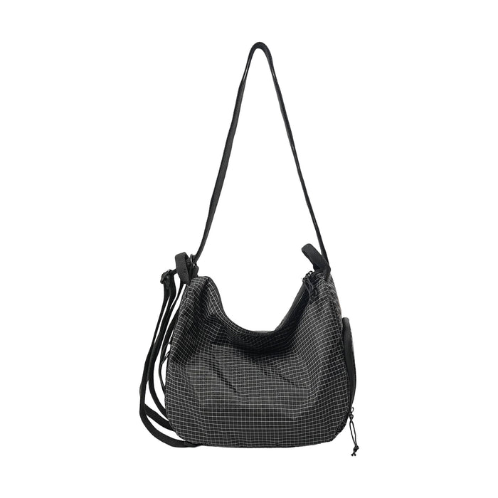 Convertible Lightweight Backpack Duffel Bag - A convertible lightweight backpack duffel bag in black with a grid pattern and multiple straps.