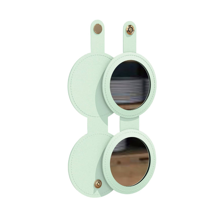 Round Folding Pocket Mirror - A round folding pocket mirror in mint green with two reflective surfaces and a logo on the side.