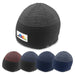 Ridge Beanie - A collection of beanies in various colours, featuring a logo on one side, with a textured knit design.