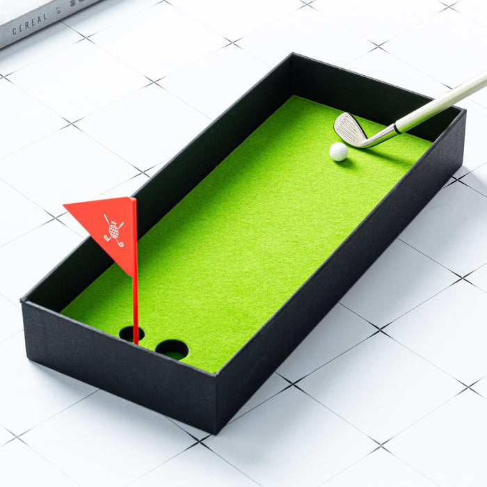 Golf Pen Gift Set - A black box containing a green felt golf putting surface, golf club, ball, and a small red flag.