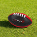 Mini Aussie Rules Ball - A Mini Aussie Rules Ball in black with red accents, featuring white laces and a logo.