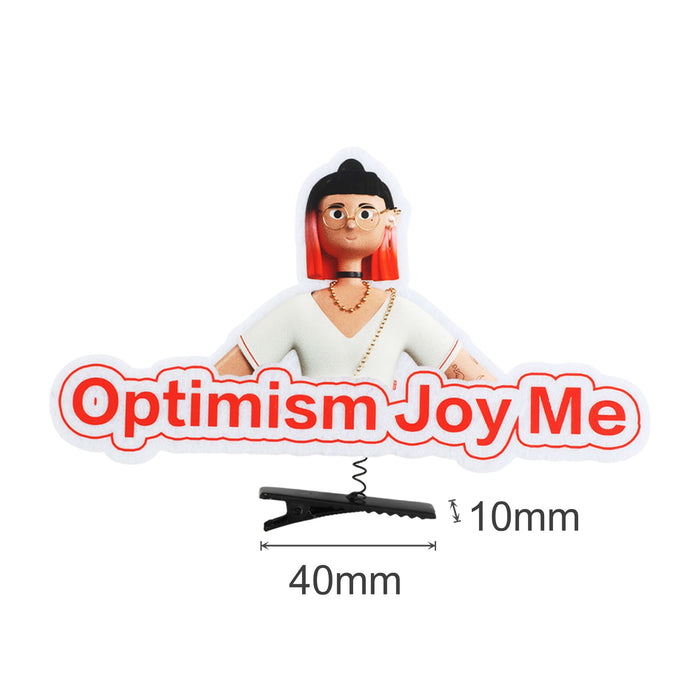 Custom Felt Spring Hair Clip - A colourful promotional clip featuring a character with red hair and a white outfit, labelled "Optimism Joy Me".
