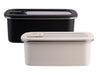 Oasis Microwave Safe Rectangular S/S Container 1.1L - A set of two rectangular stainless steel containers, one black and one cream, with clear lids and a brand logo.