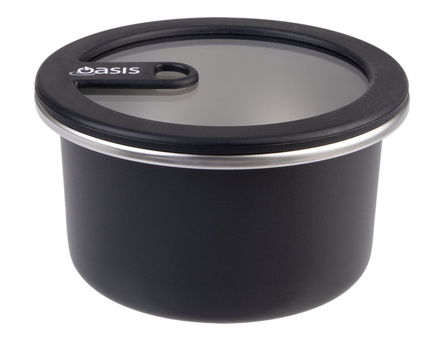 Oasis Microwave Safe Round S/S Container 680ml - A round black stainless steel container with a clear lid, featuring a logo. Capacity of 680ml.