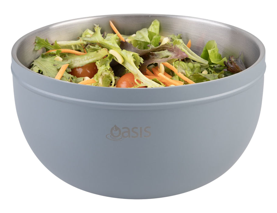 Oasis 2.8L Double Wall Salad Bowl - A double wall salad bowl in light blue, filled with mixed salad greens and vegetables. It features a logo.