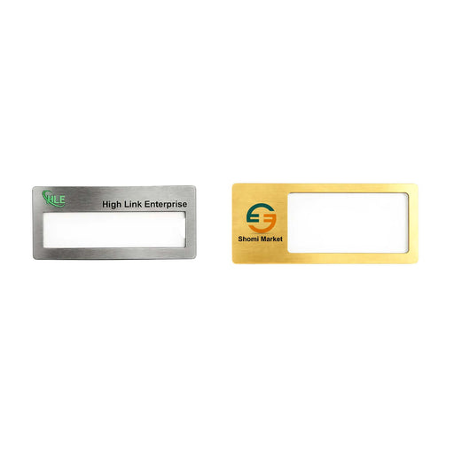 Reusable Metal Name Badge - Two reusable metal name badges in silver and gold finishes, featuring a clear window for name display and logos.