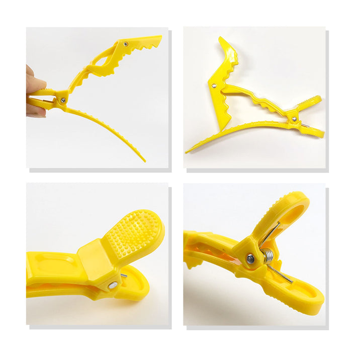 Anti-Slip Positioning Alligator Clip - A yellow anti-slip positioning alligator clip with a textured grip and adjustable design, featuring a logo.