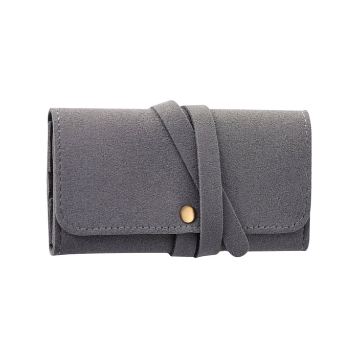 Synthetic Leather Jewellery Bag - A grey synthetic leather jewellery bag with a fold-over design and a decorative strap closure.