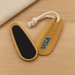 Bamboo Paddle Nail File - A bamboo paddle nail file featuring a black filing surface and a rope loop, with a logo on one side.