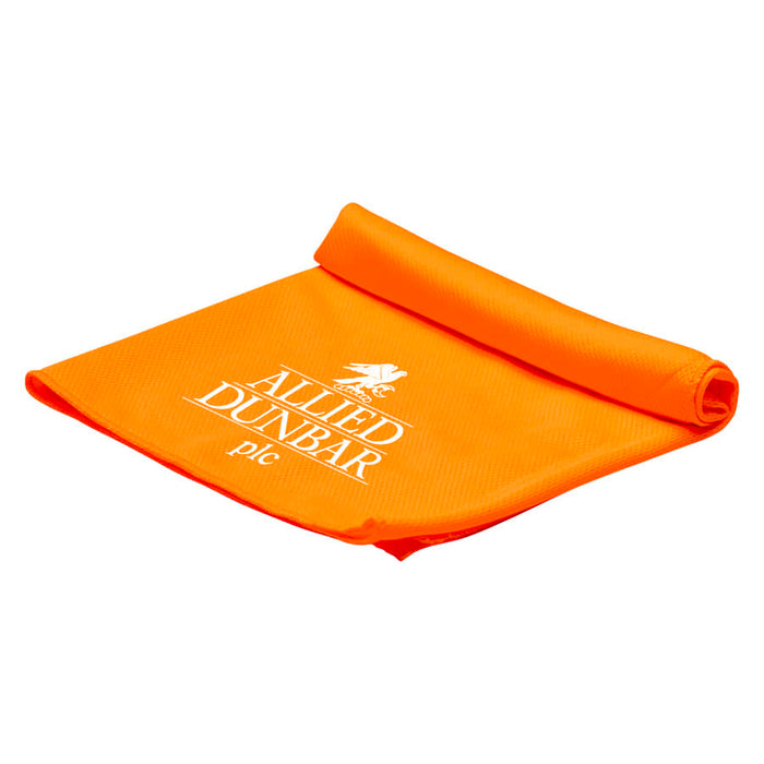 Cooling Towel - An orange cooling towel neatly rolled, featuring a logo on one side.