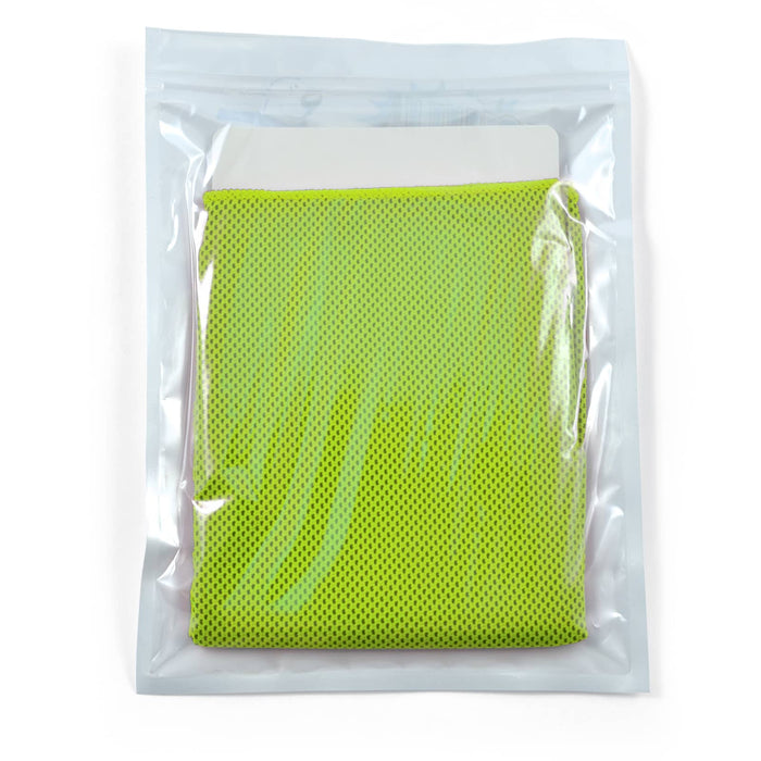 The Game Day Pack - A green cooling towel neatly packaged in a transparent pouch, featuring a textured surface.