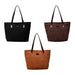 Suede Leather Tote Bag - Three suede leather tote bags in black, brown, and tan with long handles and a logo on each.