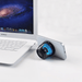 Pacific Magnetic Bluetooth Speaker Stand with RGB LED Light (Stock) - A Bluetooth speaker stand with RGB LED light in black, positioned beside a laptop and a smartphone.