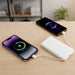 10000mAh Slim  Power Bank with Charging Cable - A white 10000mAh slim power bank connected to two smartphones on a wooden desk, with a plant in the background.