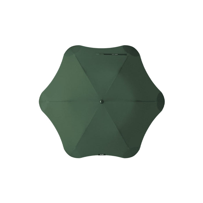 BLUNT Metro Umbrella - A green BLUNT Metro umbrella with a unique octagonal shape and a central button for opening and closing.