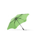 BLUNT Metro Umbrella - A green BLUNT Metro Umbrella with a black handle and a unique frame design. It features a logo on the fabric.