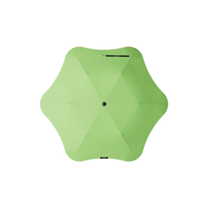 BLUNT Metro Umbrella - A green BLUNT Metro Umbrella with an octagonal shape and a central button, featuring a logo.