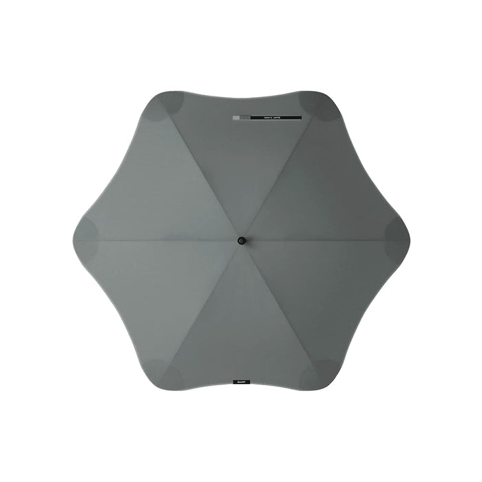 BLUNT Classic Umbrella - A grey BLUNT Classic Umbrella with a unique star-like shape and a central button. It features a logo.