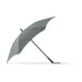 BLUNT Classic Umbrella - A grey BLUNT Classic Umbrella with a unique, aerodynamic shape and a curved canopy, featuring a logo on the handle.