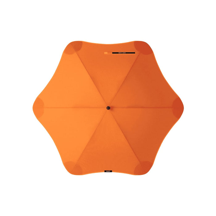 BLUNT Classic Umbrella - An orange BLUNT Classic Umbrella with a star-shaped canopy design and a central point. It features a logo.