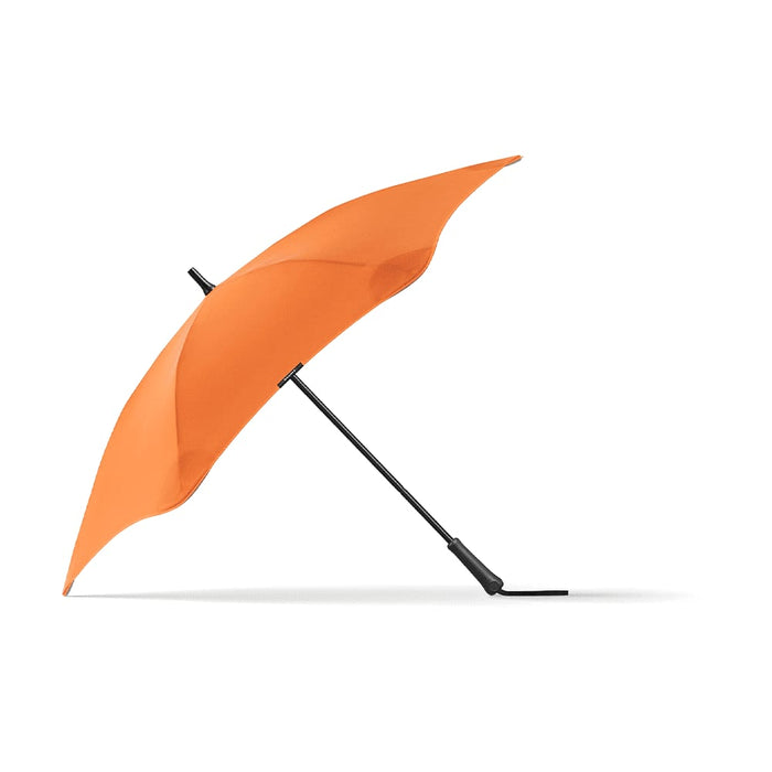 BLUNT Classic Umbrella - An orange umbrella with a black handle, featuring a sleek design and a curved canopy.