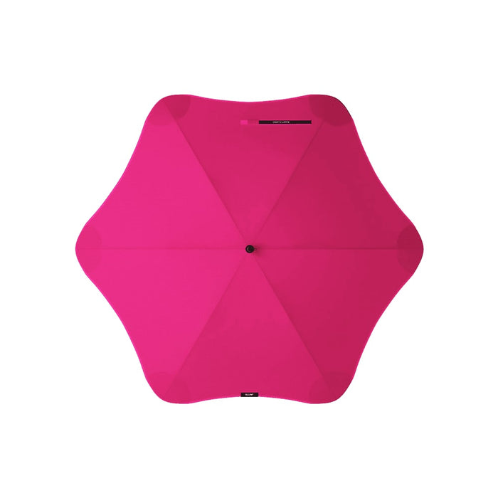 BLUNT Classic Umbrella - A pink umbrella with a star-shaped design, featuring a central button and a brand logo.