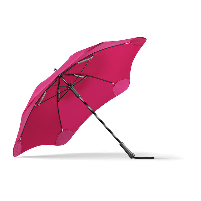 BLUNT Classic Umbrella - A fuchsia umbrella with a curved canopy and a black frame, featuring a logo on the handle.
