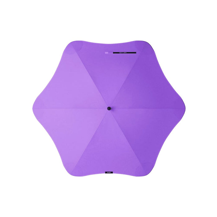 BLUNT Classic Umbrella - A purple BLUNT Classic Umbrella with a unique star-shaped canopy and a central hub. It features branding on the handle.