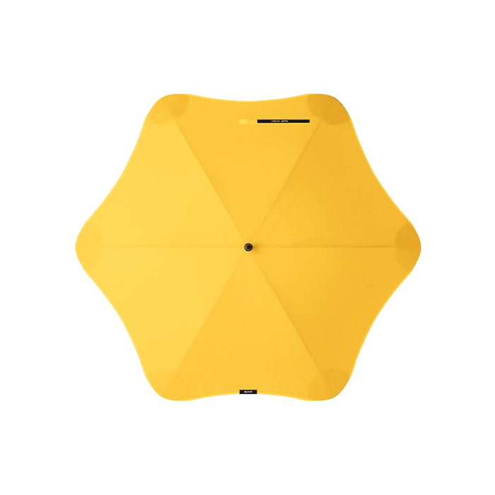 BLUNT Classic Umbrella - A yellow umbrella with a star-shaped canopy and a central pole. It has a logo on its surface.