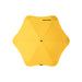 BLUNT Classic Umbrella - A yellow umbrella with a star-shaped canopy and a central pole. It has a logo on its surface.