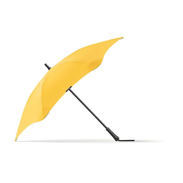 BLUNT Classic Umbrella - A yellow umbrella with a sleek design, featuring a black handle and a branding logo.