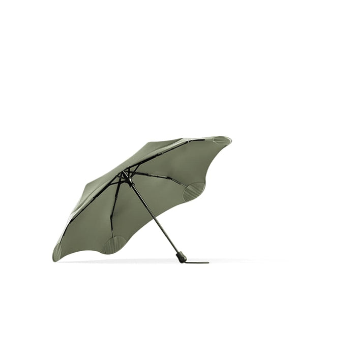 BLUNT Neo Umbrella - A green BLUNT Neo Umbrella with a unique design features a sturdy frame and a single central pole.