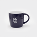 The Maxwell 330ml Ceramic Mug - A ceramic mug in navy blue with a white interior and a curved handle, featuring a logo on the side.