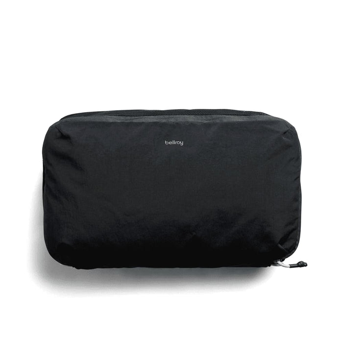 Bellroy Lite Packing Cube 12L - A black packing cube with a zipper and a small logo, designed for travel organisation.